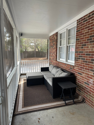 outdoor lounging/screened porch - Enjoy some space and privacy at the Randall home