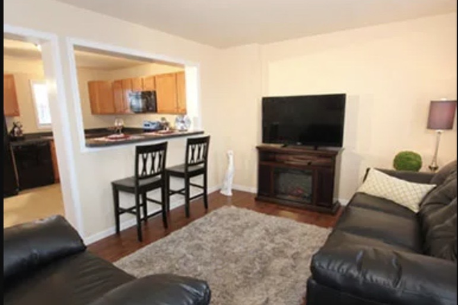 Living room with view of island and kitchen - The Villas Att Happy Valley Townhome