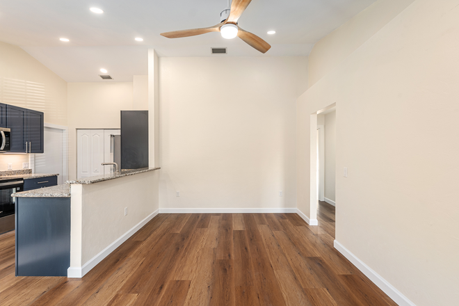 Open floor plan living room/ kitchen - Rare Find! Beautifully Remodeled 3BR/2BA Duplex in Turkey Creek Golf Course Community! Duplex