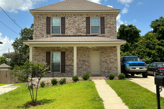 Brick home with covered front porch, rear patio and fenced back yard with outside storage building.  Five minutes drive to campus. - 510 26TH AVE E