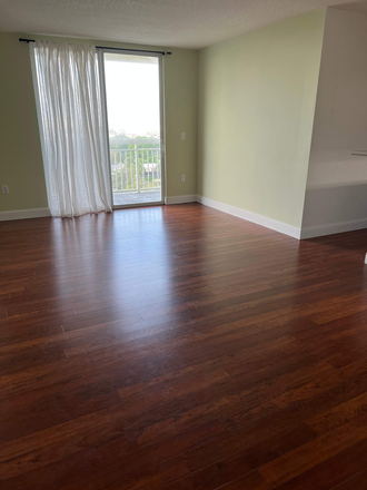 living room and balcony - Seybold Pointe Condo - walkable to UM medical school campus and hospitals