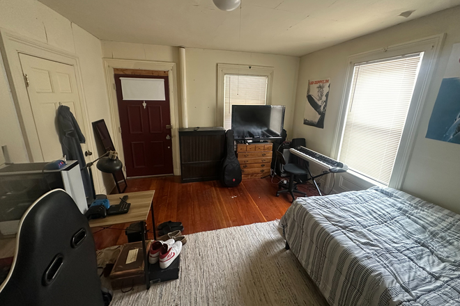 Bedroom (additional angle - red door is access to front screen-in porch) - House Apartment owned by TMA