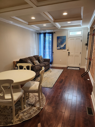living room - Three-bedroom, furnished home only a leisurely walk from Johns Hopkins Medical Campus