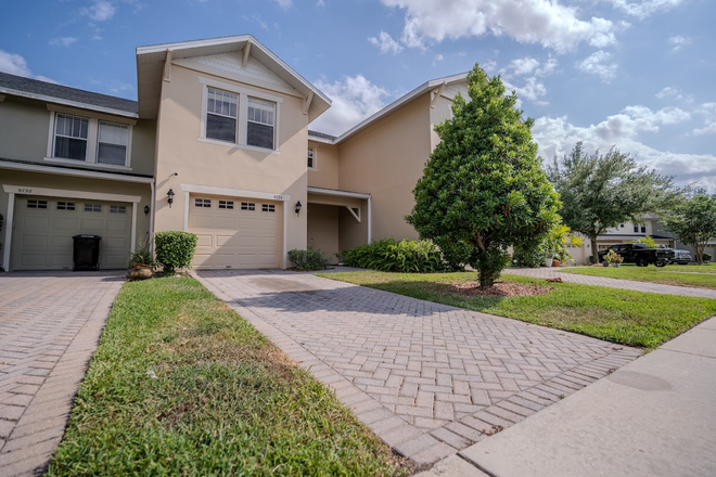 Exterior with Paver Driveway - Furnished 3/2 with Garage!  Great East Orlando Location Close to Colleges! Townhome