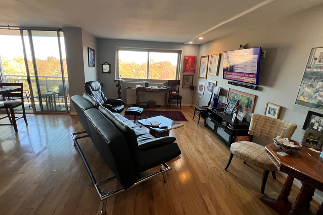 Living Room - windows face east - Penthouse 1200 sq.ft. - UTILITIES -INDOOR PARKING--Washer/Dryer ALL INCLUDED, ample storage&sunlight
