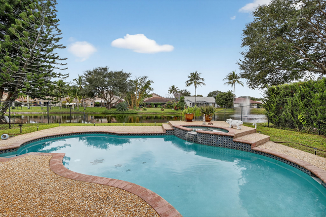 Pool during day - Waterfront home on lake with pool in prestigious Forest Ridge