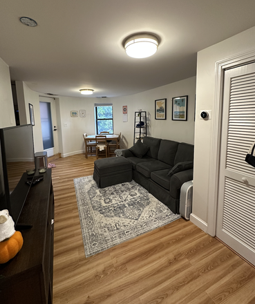 Living Room - 1 Bedroom Close to Campus w/ Private Patio Condo