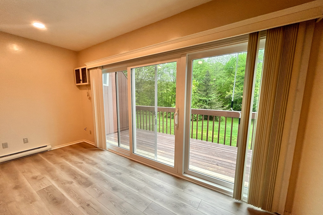 The deck offers so much fresh light - HUGE Luxury Renovated Condo – Steps from UConn, Pool + Washer/Dryer
