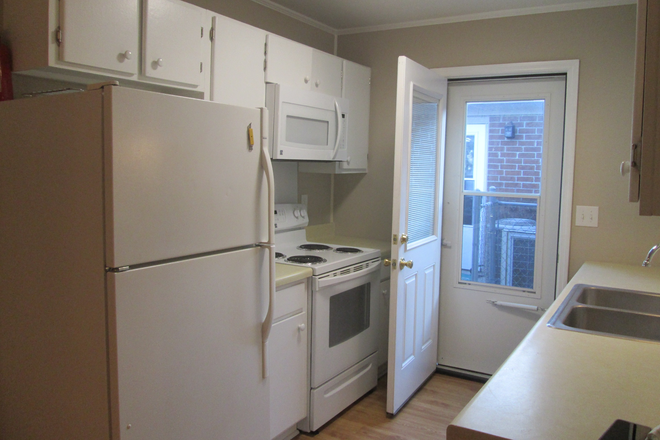 kitchen: frig, new range, new microwave, new dishwasher, new countertop, new sink and new plumbing, side entry storm door - WEST ASHLEY CHARLESTON Duplex