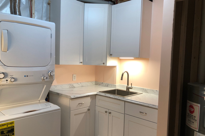 Shared laundry & renter's kitchenette (sink w/ garbage disposal & cabinets; space for renter's own fridge & microwave) in utility rm. - 800 sq ft private space (bd, bath, living rm) + kitchenette in shared laundry rm; available 1/1/26 House