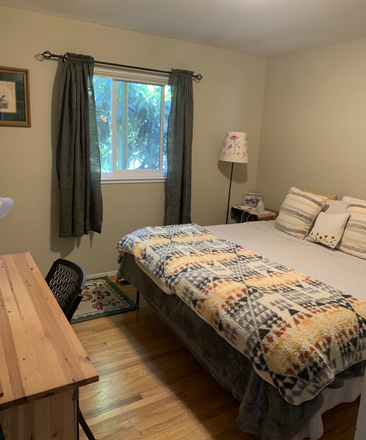 Bedroom with desk, chair, bed, lamp, 2 nightstands - Furnished Room in a Lovely LGBTQ-Friendly Home with Stunning Views