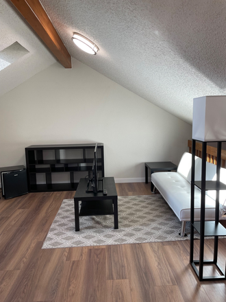 Loft with skylights. Includes futon, coffee & side table, lamp, tv, bookcase, small fridge, fan - Gold Run Place Townhome