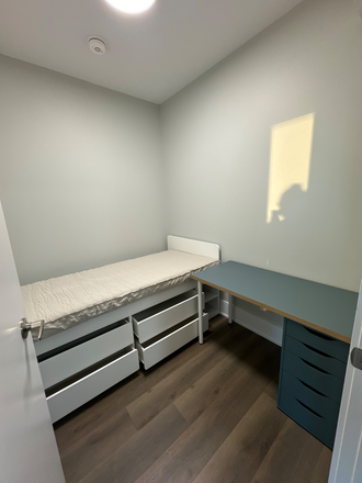 Only bed comes with room. Desk is not included. - Furnished small bedroom with private bathroom located next to kitchen.