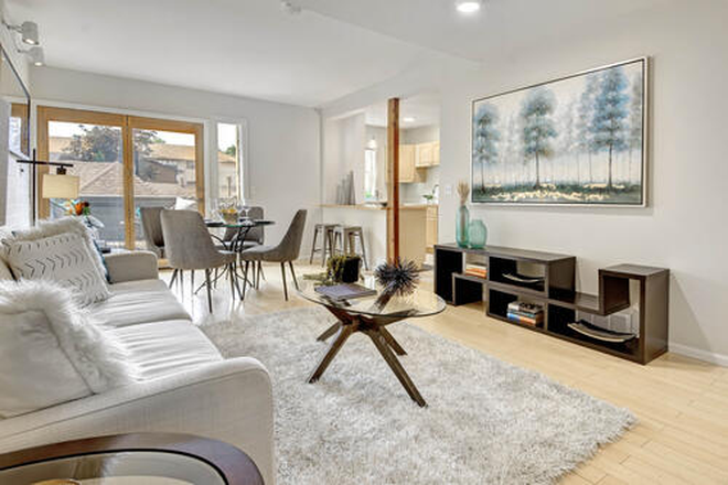 Open Concept (Living, Dining, Kitchen) - Perfect location! 2 bedroom with 2 parking spaces and great deck! Condo