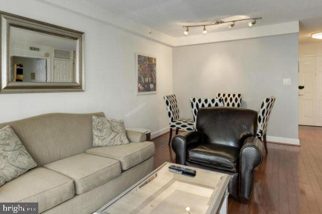 Open living and dining area. - Elevated Living Near the National Cathedral Condo