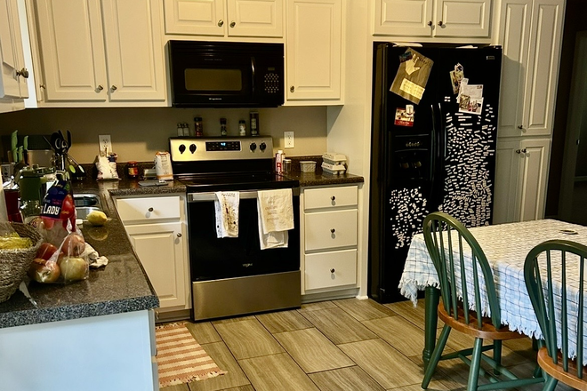 Kitchen with table and chairs, shared by all residents - One bedroom w/shared bath available as of 5/1/26 (in a 4 bedroom ALL GIRLS home ONLY)