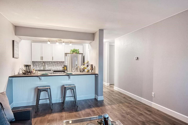 Living Room/Kitchen - 2- Bedroom, fully remodeled, top floor unit with views of the mountains-close to CU and amenities