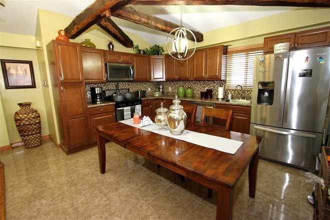 Kitchen - Spacious 4BR Apartment Near JFK/UMass – Hardwood Floors & Modern Kitchen