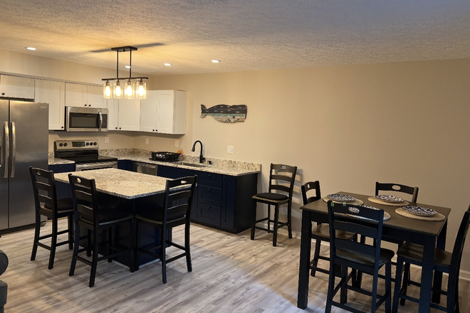 Living area and kitchen area - 1 bedroom in renovated & furnished TH, live with 3 others, 12 min walk to VT, easy walk grocery/bus