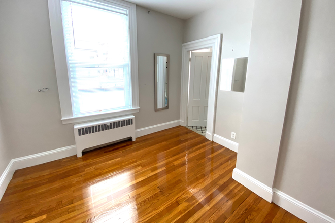 Living Room - Large, Sunny 1 Bedroom Apartment. Walk to Brown. Heat and Hot Water Included.