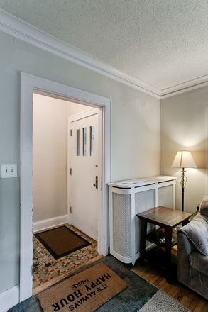 front entry way with a coat closet - Awesome three bedroom apartment one block to campus