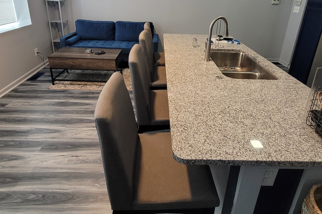 Living room and kitchen island - 320 Mohawk Street unit 1 Apartments