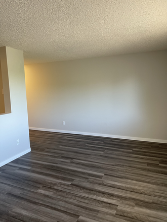Living Room Two-Bed Remodeled - One, Two, and Five Bedrooms On Johnson Apartments