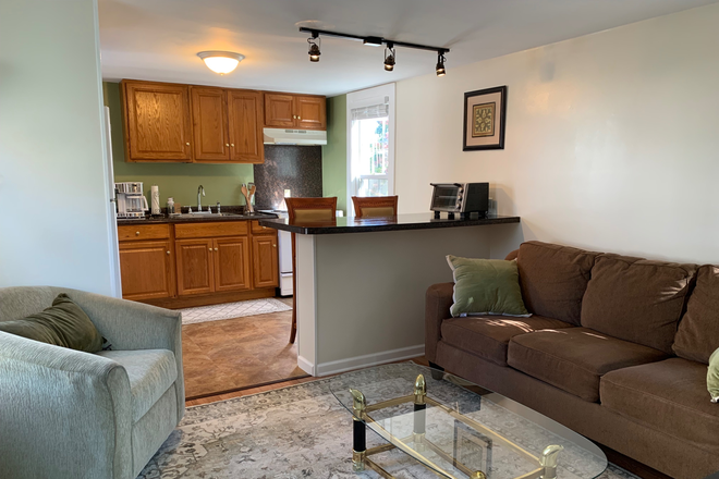 living room into kitchen - Sunny & Sweet second floor apartment