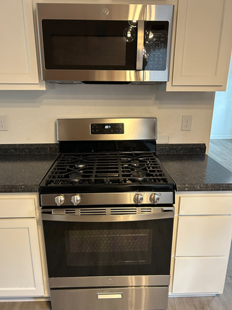 Stainless range/micro combo with 42" Shaker style cabinets - Private 1 Bedroom in Beautiful Victorian Home w/ front porch + Pet OK