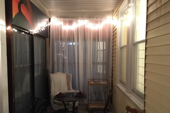 porch at night, with inviting lighting - 4  BDRM FURNISHED avail JUNE 2025 Free Laundry IN APT, WiFi, Parking,Porch