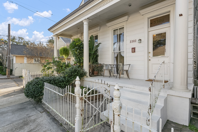Exterior entrance, porch and fence - Furnished Garden District 2 bedroom, 1 bath apt