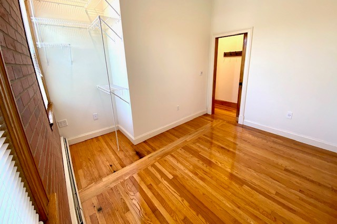 Bedroom 3 - Avail 7/1/26 Four Bedroom, two full bathrooms, hardwood floors above Bueno Y Sano Apartments