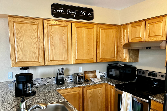 The fully stocked kitchen area.  Microwave, blender, new appliances, dishwasher, all pots/pans/dishes - 3095 29th Street/Winds 11 Condo's.  Fully furnished executive style condo