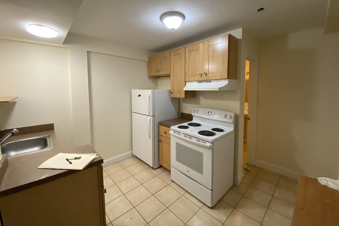 Visit hubrealtyproperties.com - Renovated one bedroom, basement level, on the T in Mission Hill, near HMS Apartments