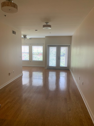 Living room and sun room - The Bristol on Broadway Apartments