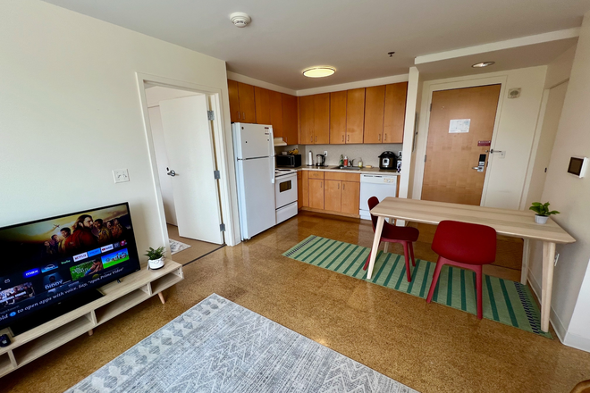 Living room 2 - One Western Ave -- furnished bedroom & private bathroom in 2BR/2BA Apartments