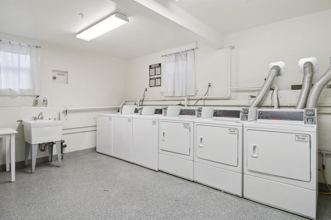 Laundry room with washing machines neatly arranged - 2333 Channing Way