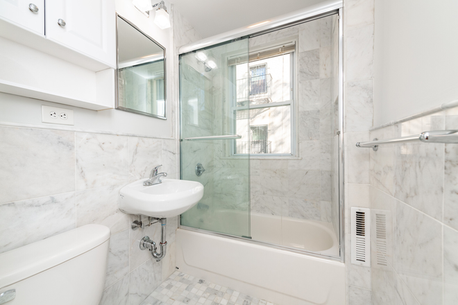 Visit hubrealtyproperties.com - Large studio with new kitchen and bath, on green line T in Brigham Circle Apartments