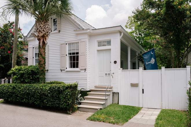 Street View white gate has been removed and replaced with a gravel parking spot - Historic Design Freedman's Cottage