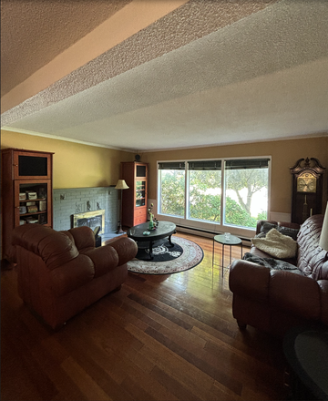 Living Room - Sunny 4-Bedroom Home with 1.5 Baths, 10-Minute Walk to U of T
