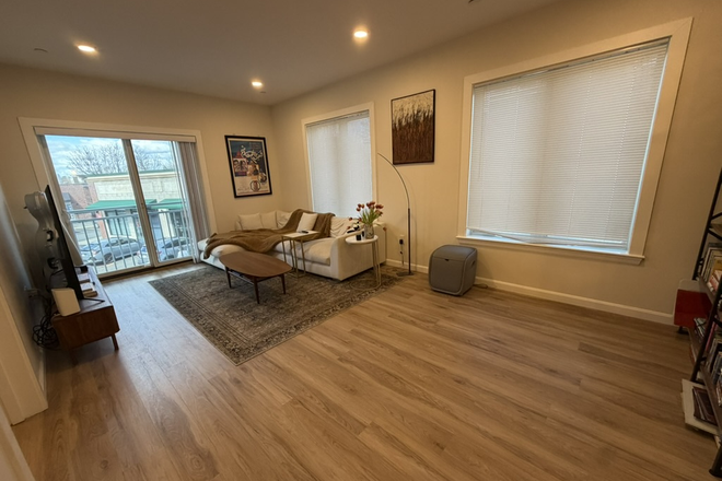 living room - New construction 1 bed + den with AC and in unit laundry - NO FEE! Apartments