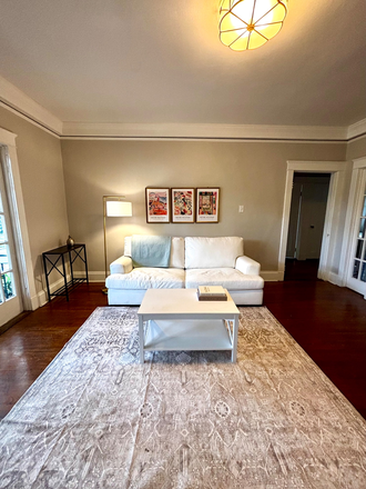 Living room, new sofa, coffee table, consoles, and rug, and art. - Spacious, 3 bedroom, two bath, partially furnished, close to campus, renovated kitchen. Apartments