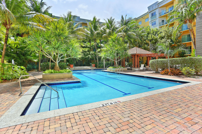 [web address removed] - 2 Bed, 2 Bath Valencia condo with 2 parking spaces, resort amenities, and Metrorail near UM