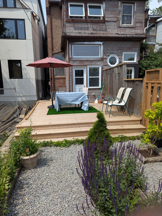 Shared backyard porch - Furnished Basement Studio Apartment with laundry
