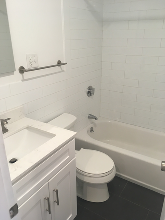 Visit hubrealtyproperties.com - On the Green line T, gorgeous 2 bedroom with dining room, on a tree lined street Apartments