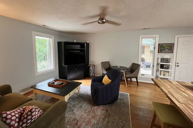 Living room - Gorgeous fully-furnished in-law suite located 15 minutes from campus with all amenities included Apartments
