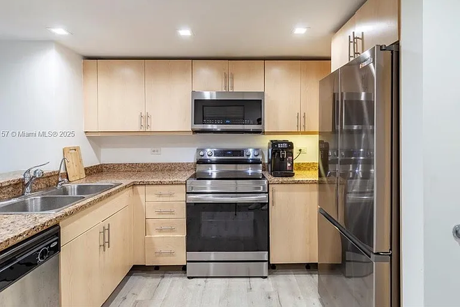 Kitchen - Flagler & First – Walkable, Central, Connected Apartments
