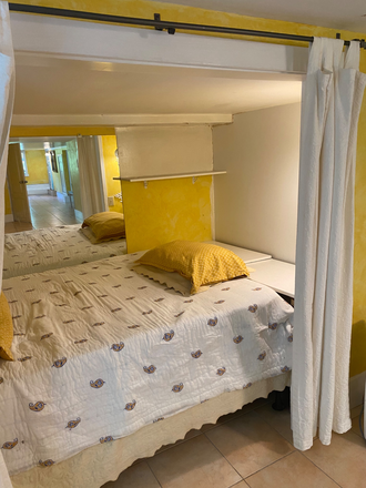 Bed area - Garden Studio with Private Entrance - Fully Furnished Apartments