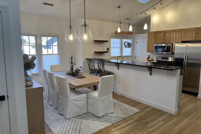 Open dining area and kitchen - Upscale 3 bedroom condo walking distance to Harvard