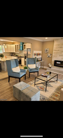 Living room - Rooms for rent- utilities/laundry/parking  included. Call / text to tour